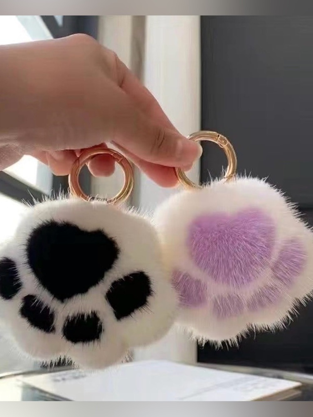 Soft Paw 🐾 Pom Pom Keychain - 3 colors left!. Pink, purple, & white with black